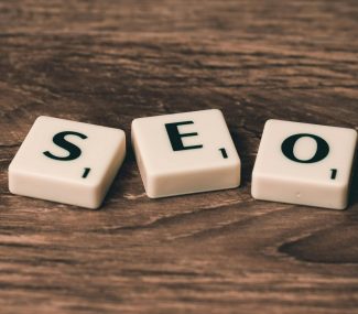 alphabet tiles that spell out SEO on a brown surface